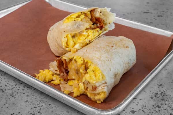Flour tortilla breakfast burrito filled with scrambled eggs, crispy bacon, melted cheddar, and golden hash browns — perfect for a grab-and-go morning meal.