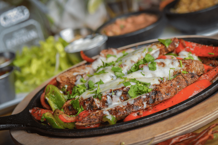 Sizzling Fajitas Loco Eats Loco Patrõn Mexican Restaurant in AZ