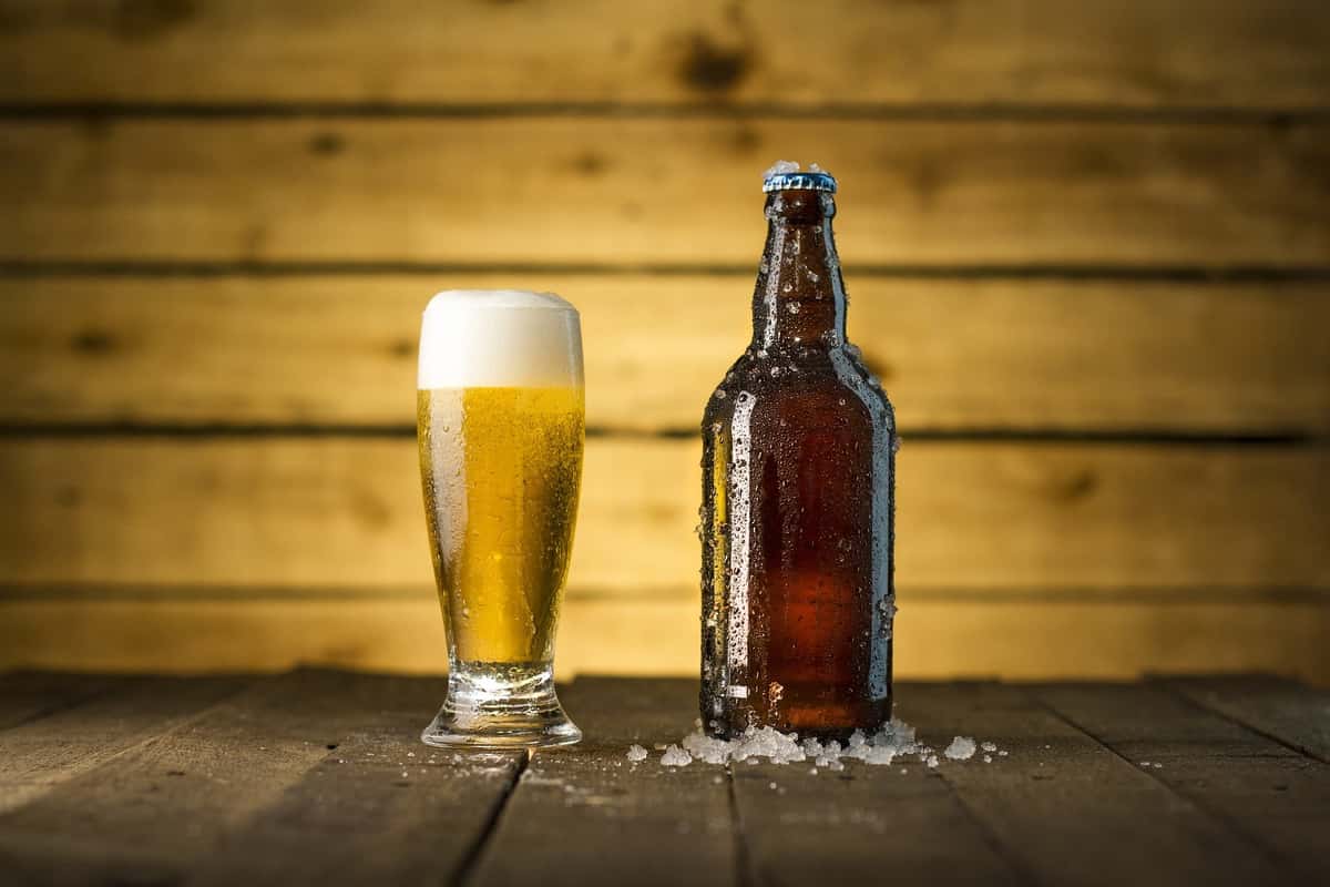 Glass of beer and bottle of beer