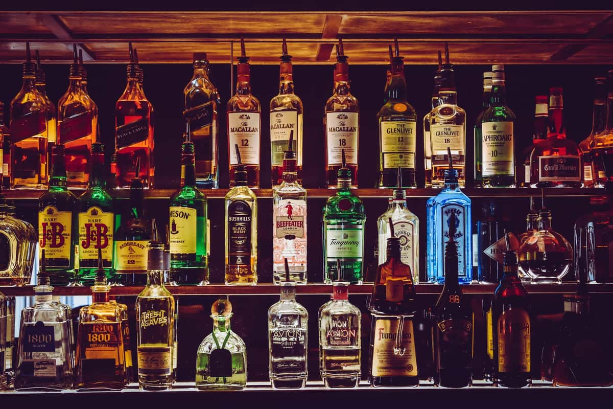 Bar back counter with liquor bottles
