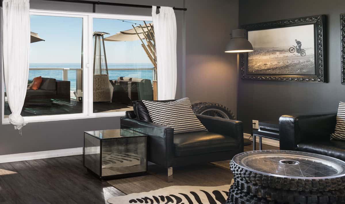 photo of fox room with leather chair and beach view