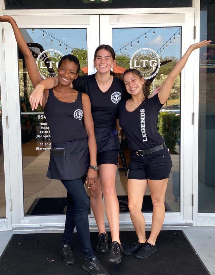 Staff with a variety of meals and drinks