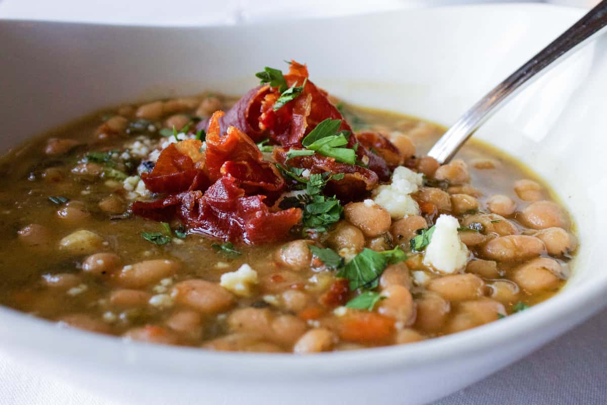 Close up of a Seasonal bean soup with a spoon