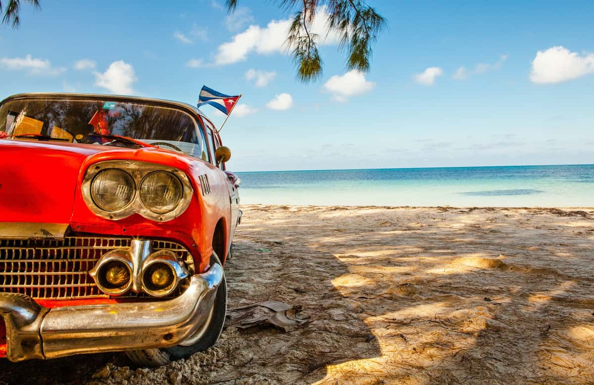 vintage red car on beach