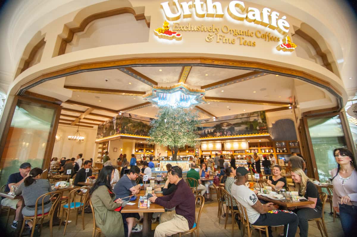 Exterior view of Urth Caffe at the Wynn in Las Vegas showing guests at table along walkway