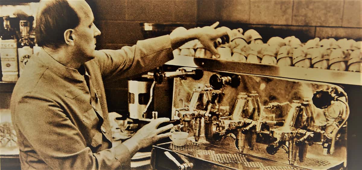 Man makes coffee with an espresso machine