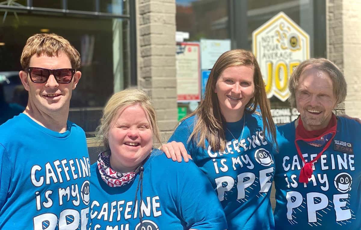 Group wearing 'Caffeine is my PPE' shirts