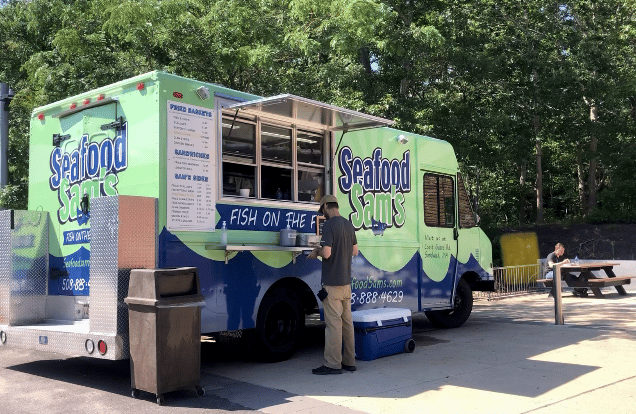 Customer orders from food truck outside Lorusso Technology Building