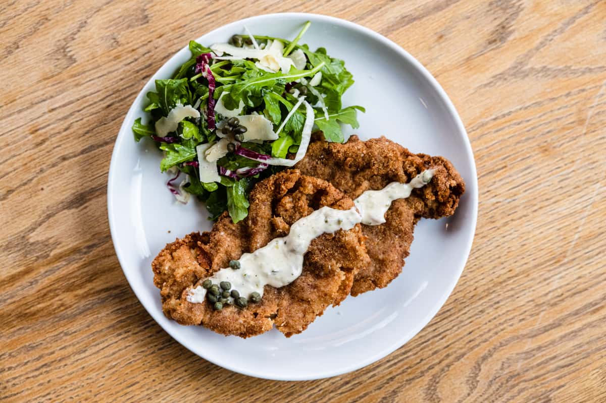 fried chicken with gravy and mixed greens