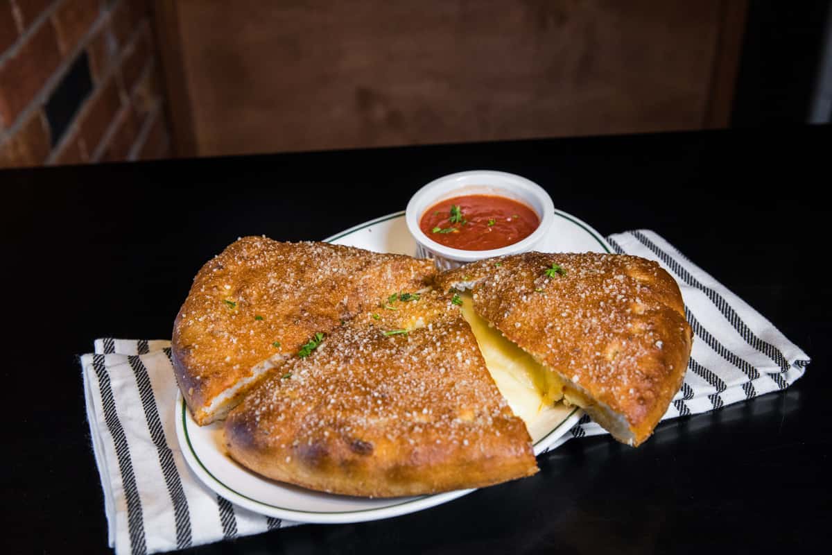 Order Calzone food online from Molinaro's Ristorante store, Lockport on bringmethat.com