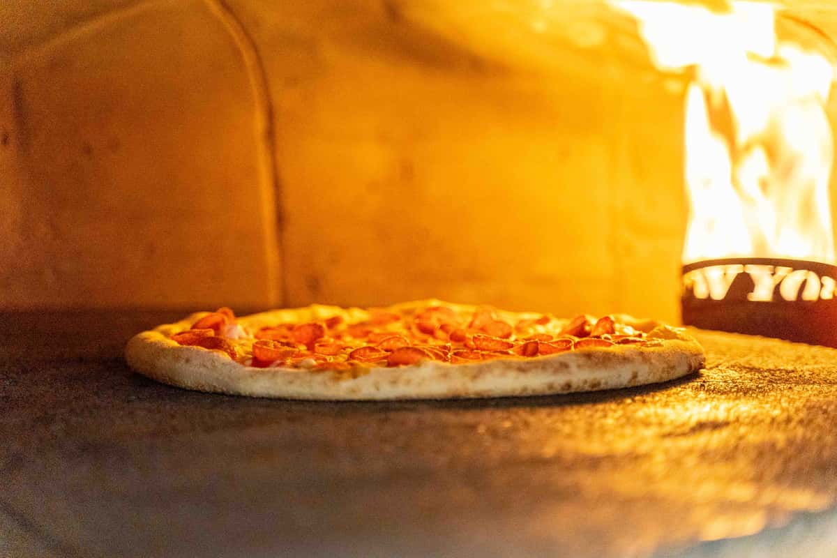 Pizza cooking in oven