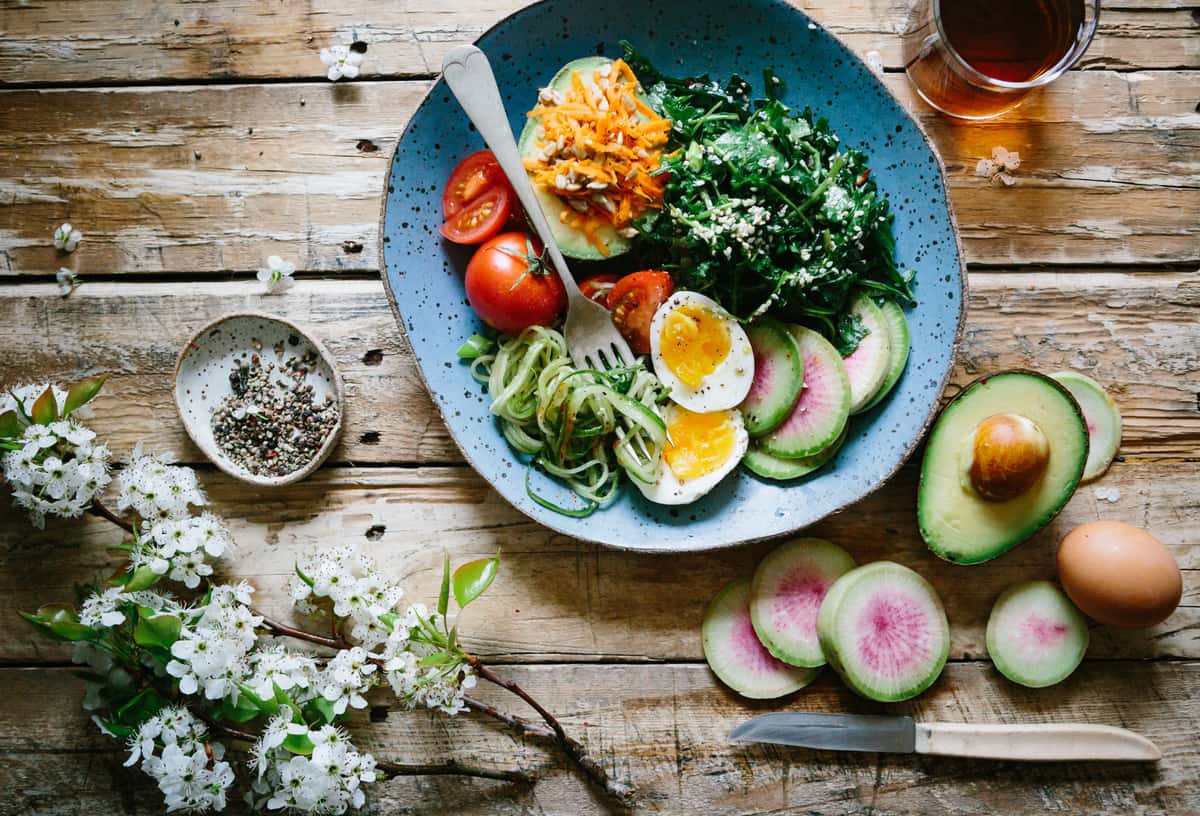 wooden table with plate of food