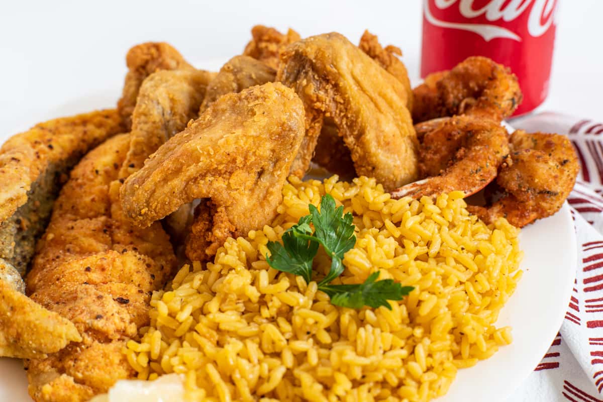 # 72. 4 Wings, 4 Pieces Medium Shrimps, 2 Pieces Fish, Rice or French fries & a Can Soda