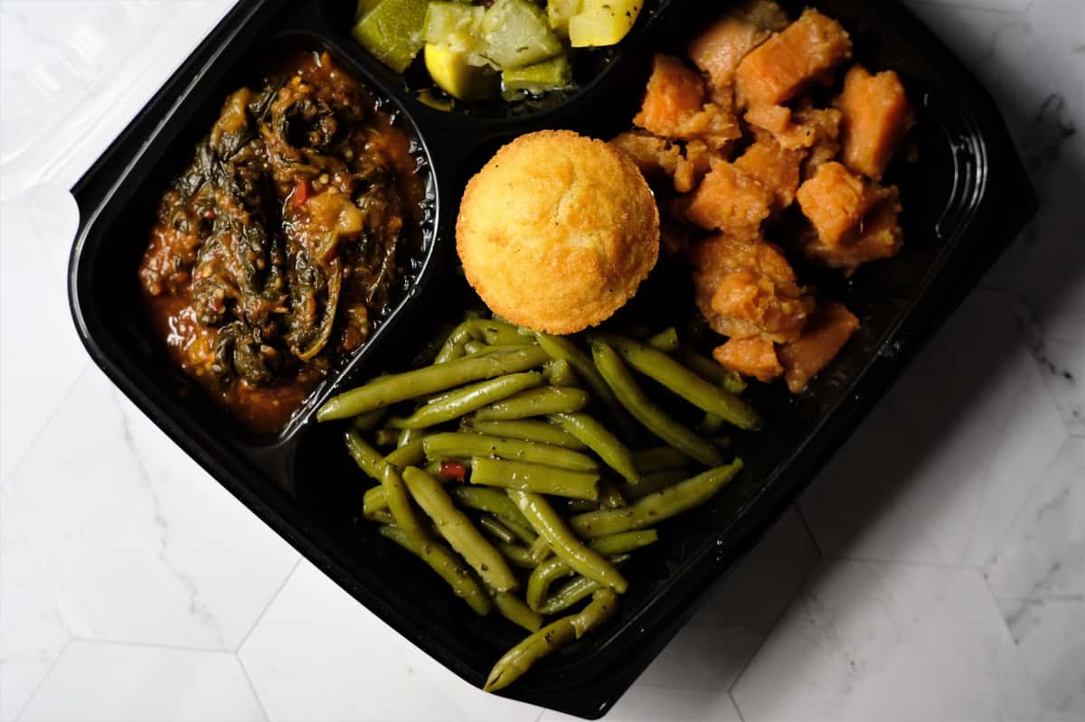 Vegetable plate with Fresh eggplant, squash and zucchini , sweet potatoes, green beans and corn bread.