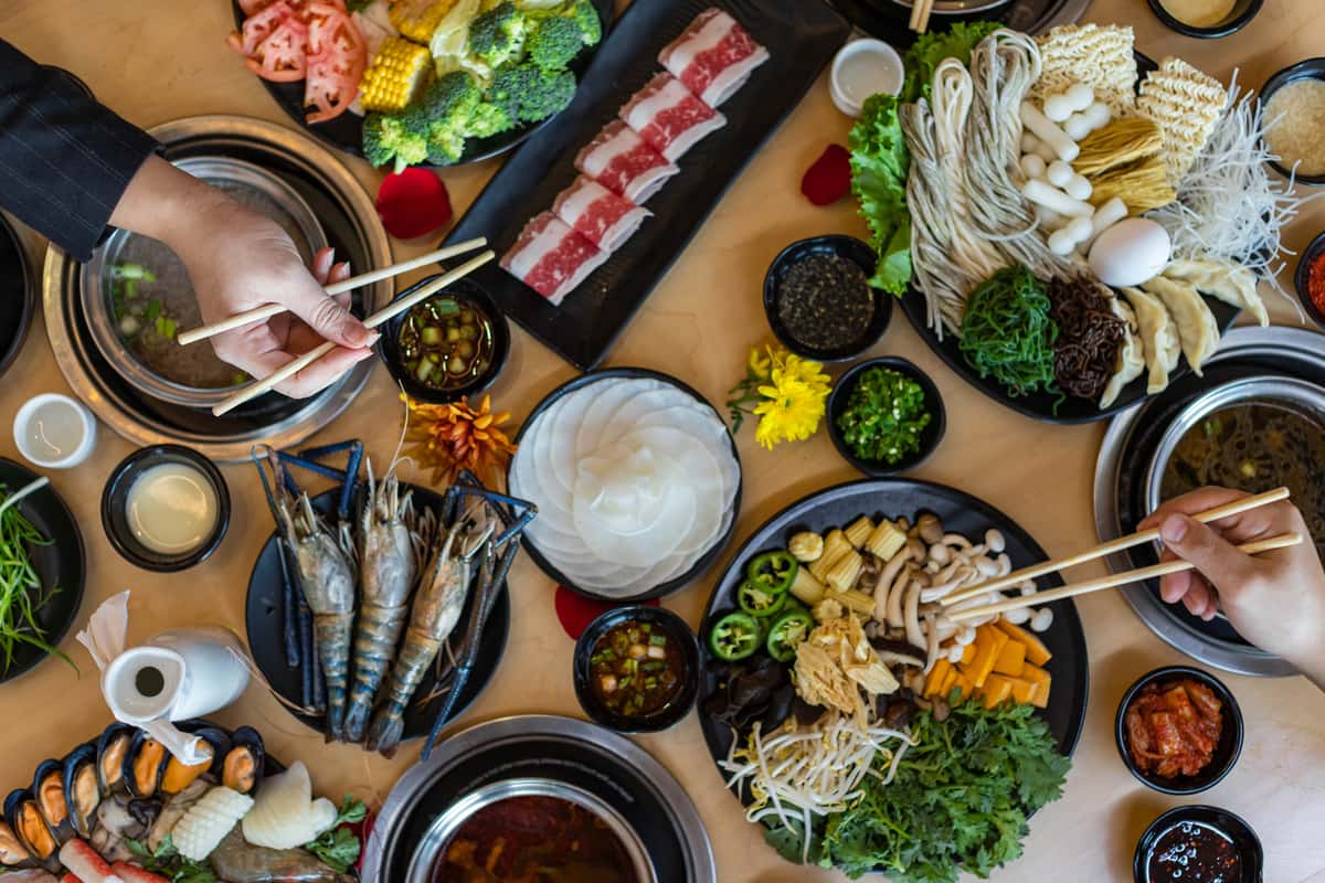 Two people eating shabu shabu together