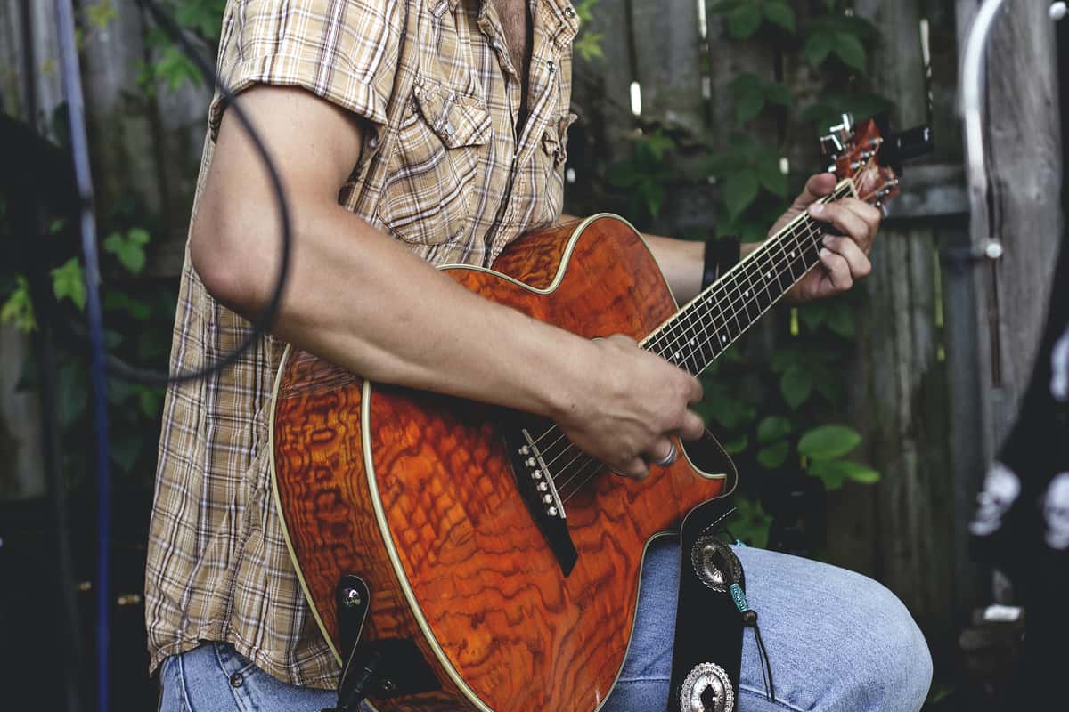 Man playing a guitar on stage
