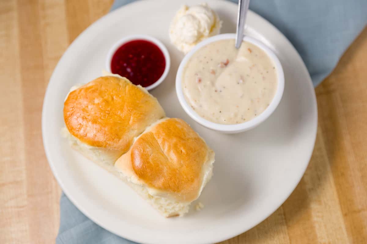 biscuits and gravy with side of jam and butter