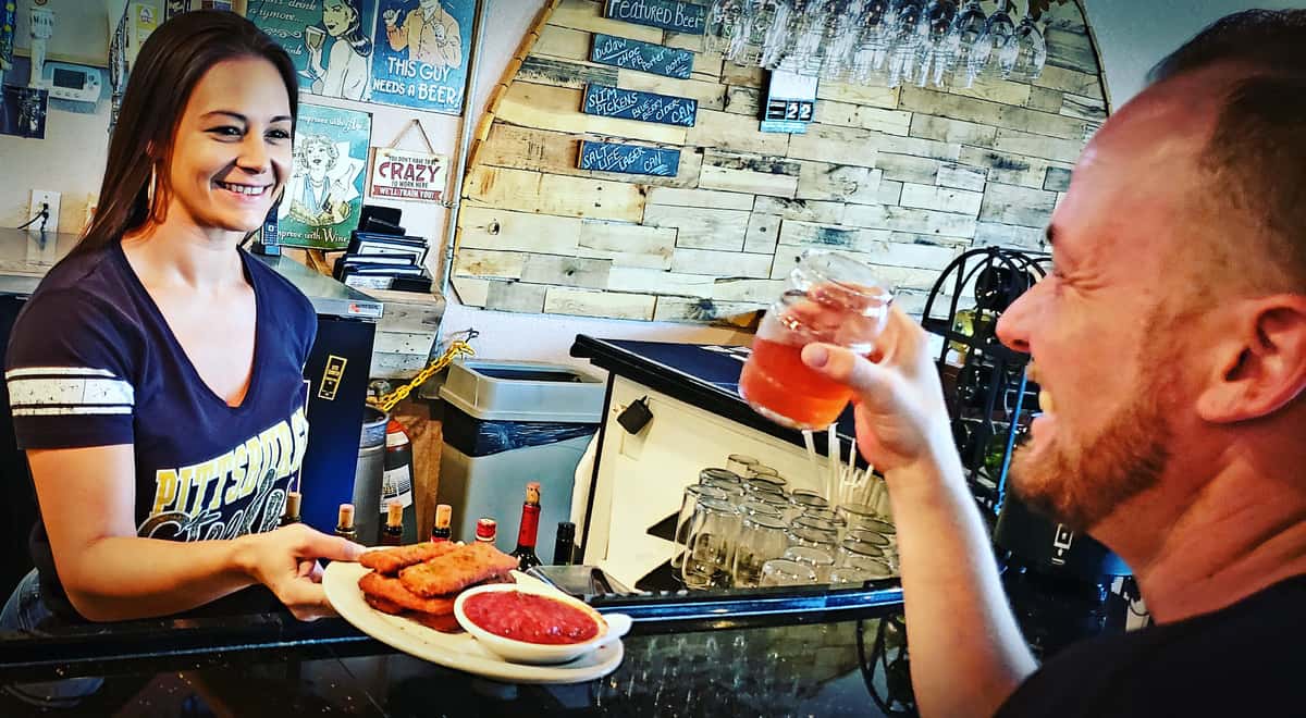 Happy employee serving guest