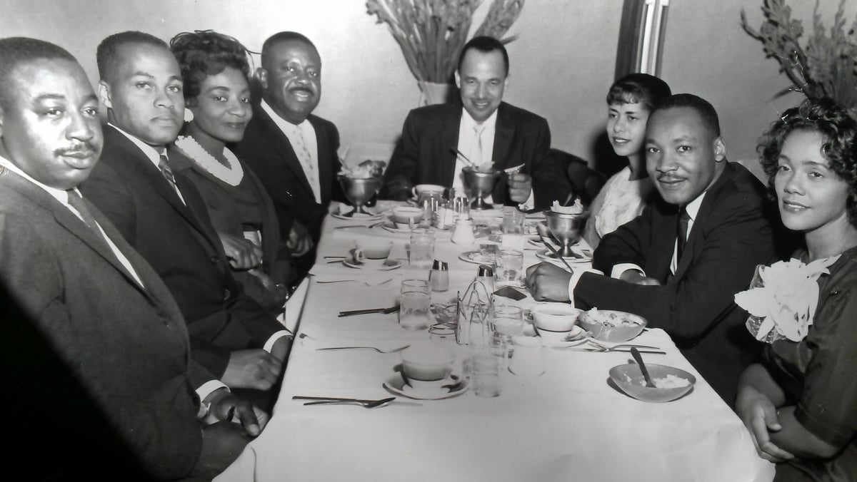 Rev. Fred Bennett, Mr. Isaac Farris, Sr., Mrs. Christine King Farris, Rev. Ralph D. Abernathy, Dr. Roy C. Bell, Mrs. Clarice Wyatt Bell, Dr. Martin Luther King, Jr., Mrs. Coretta Scott King; Pascal’s Restaurant, Hunter St., Atlanta, GA. ~1962 — Photo via Dr. Clarice Bell on Flickr