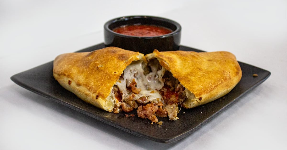 Meat Lover Calzone Calzones and Stromboli Village Pizza Pizza