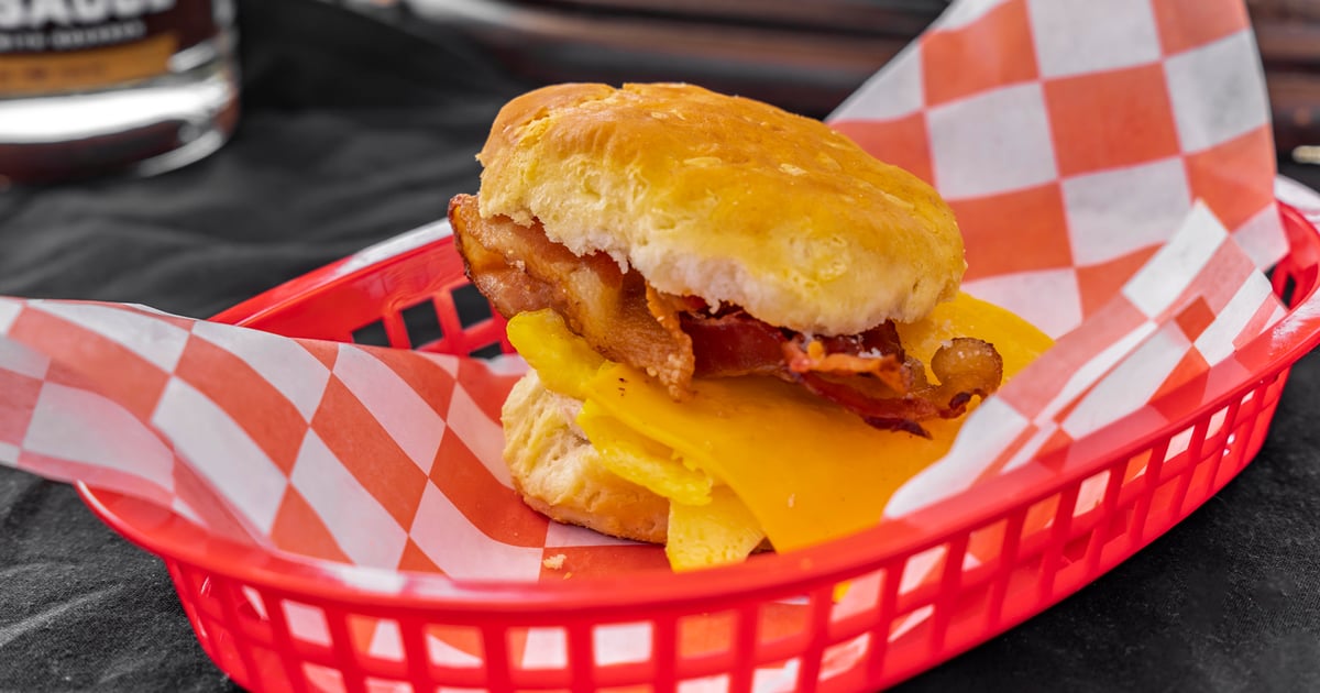 Breakfast is served 🥓🍳🍓 Bacon Egg and Cheese with Strawberry Preserves  all in between a buttery biscuit 🙌 All cooked on the Outpost Grill…