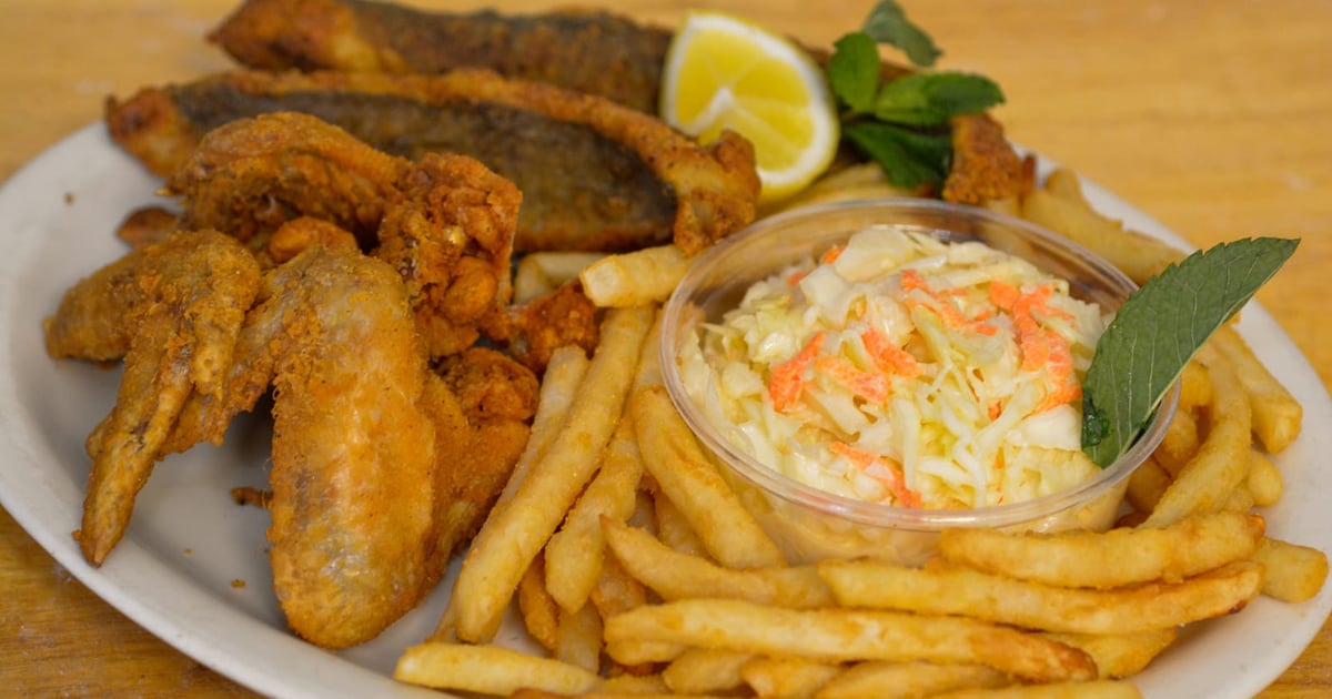 78. 3 Chicken Wings, 3 Pieces Fish, Rice or French Fries & Can Soda