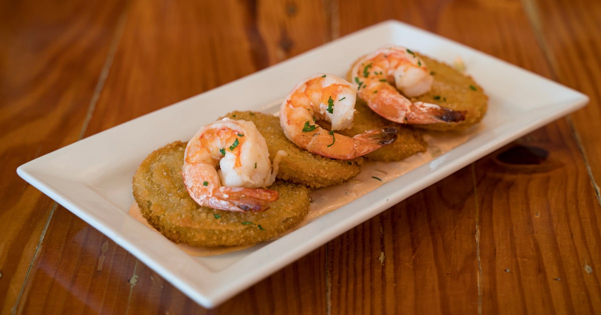 Shrimp & grits side dish appetizer in fancy martini cocktail glasses -  steaming hot southern comfort Stock Photo by wirestock