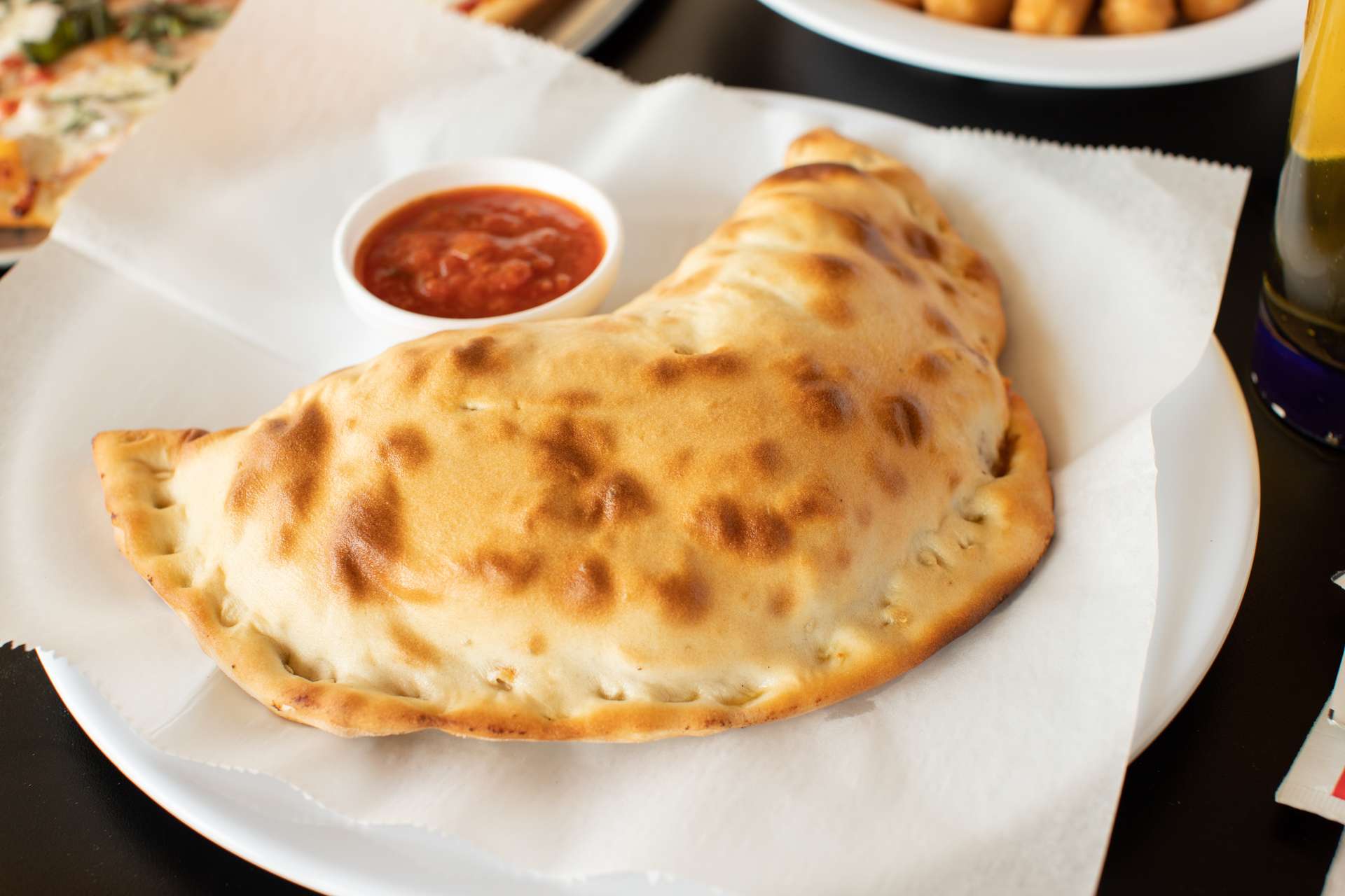 Order Build Your Own Calzone food online from Luigis Pizzeria store, Houston on bringmethat.com