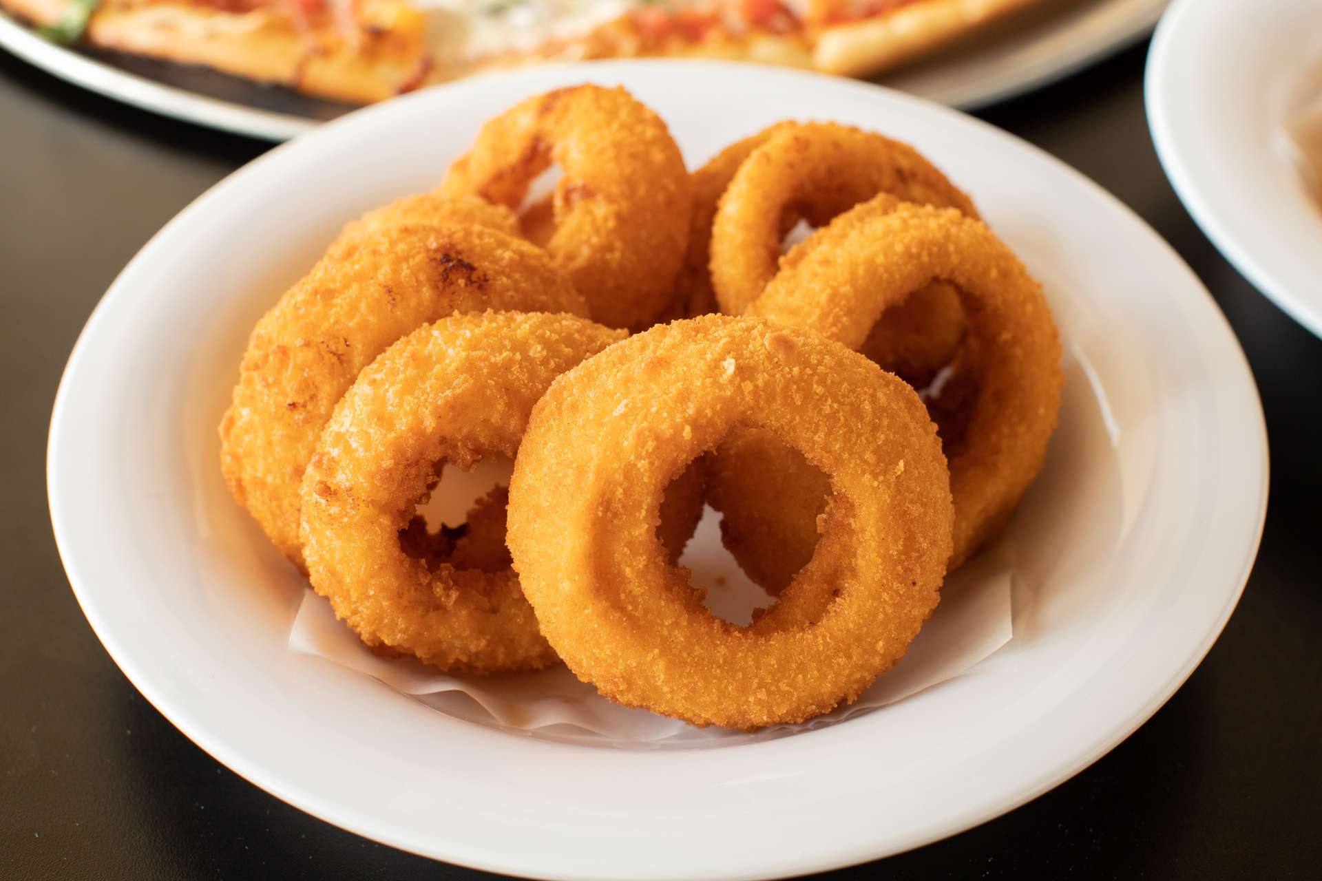 Order Onion Rings food online from Luigis Pizzeria store, Houston on bringmethat.com