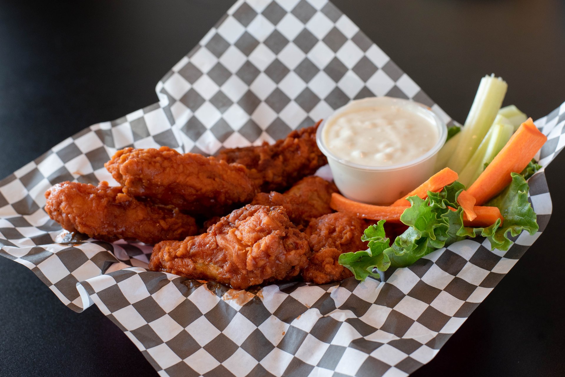 Wings recipe served on a plate, by Double Front Cafe & Bar Wings recipe served on a plate, by Double Front Cafe & Bar