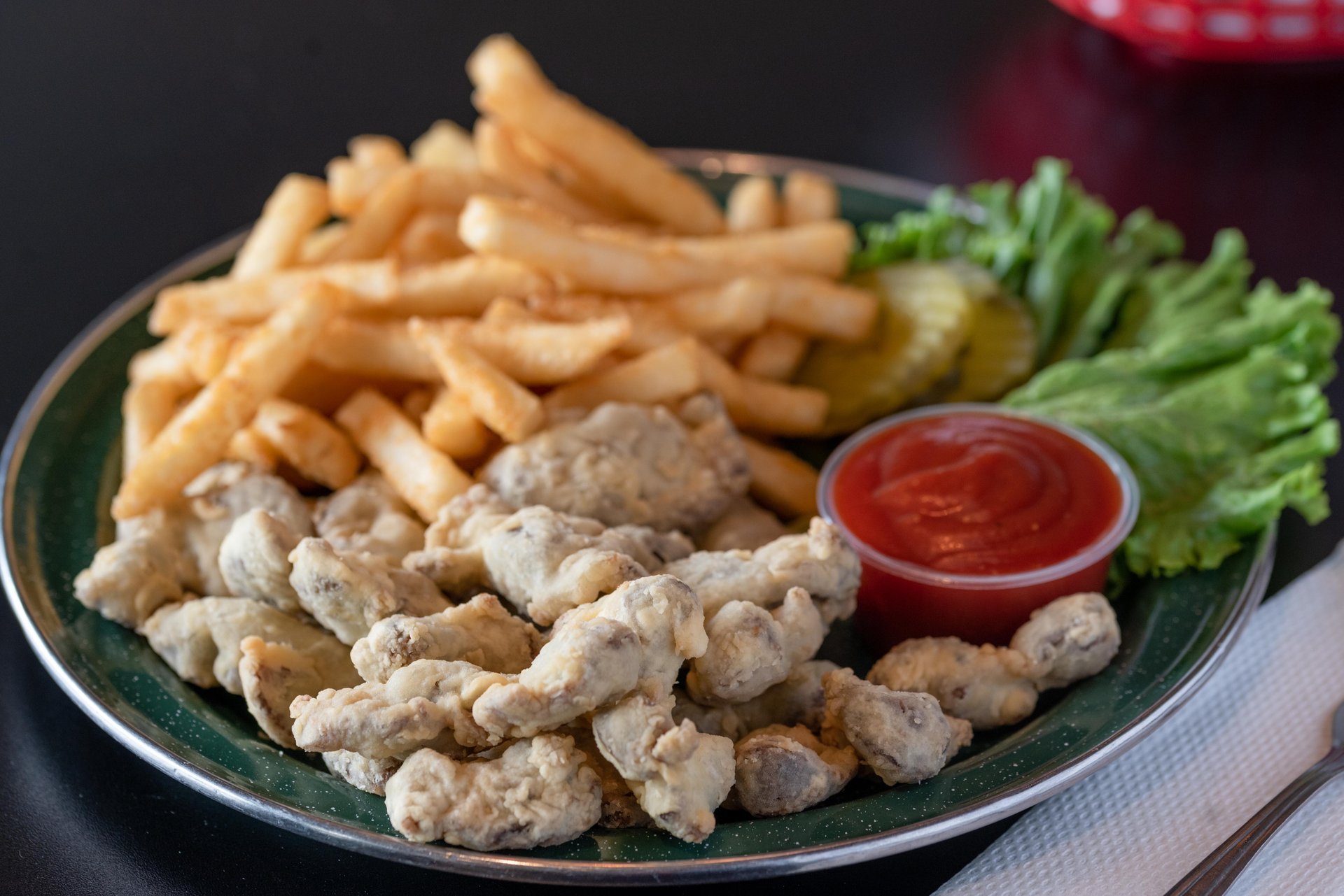 Gizzards recipe served on a plate, by Double Front Cafe & Bar Gizzards recipe served on a plate, by Double Front Cafe & Bar