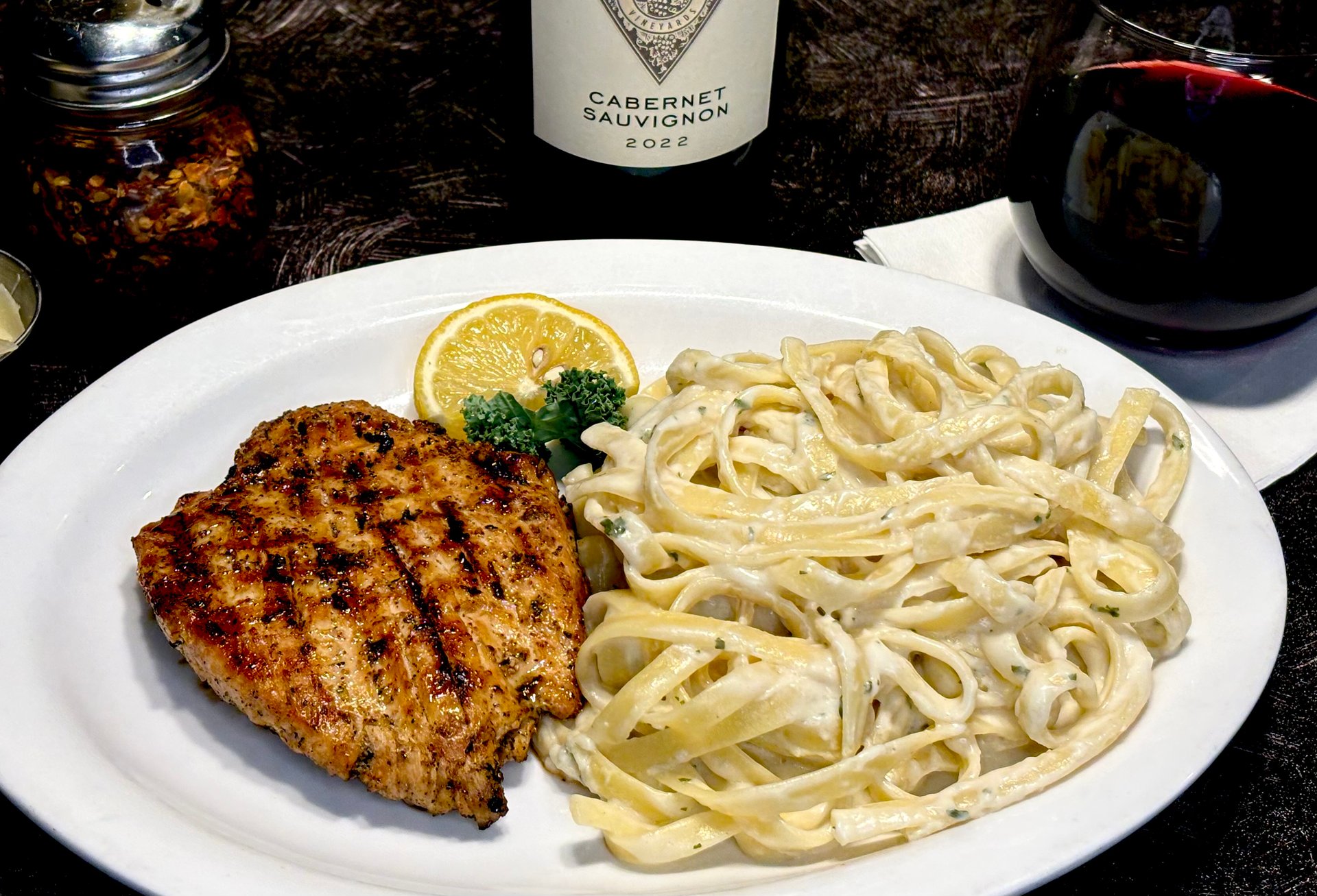 Grilled Sicilian Chicken Breast recipe served on a plate, by Angelo's Italian Restaurant - Wichita Grilled Sicilian Chicken Breast recipe served on a plate, by Angelo's Italian Restaurant - Wichita