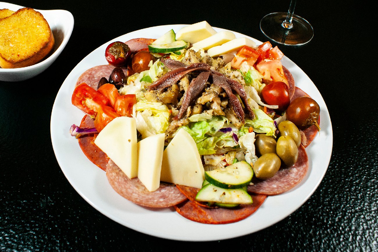 Angelo's Antipasto recipe served on a plate, by Angelo's Italian Restaurant - Wichita Angelo's Antipasto recipe served on a plate, by Angelo's Italian Restaurant - Wichita