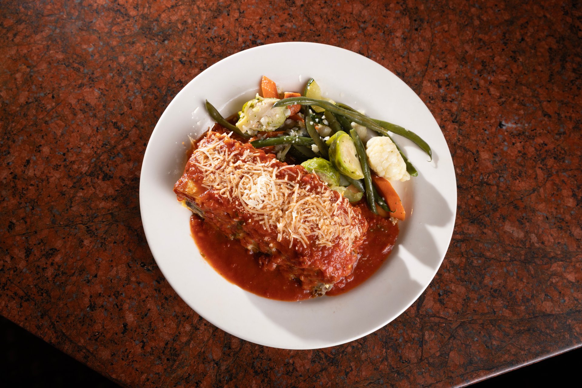 Baked Lasagna recipe served on a plate, by Original Joe's San Jose Baked Lasagna recipe served on a plate, by Original Joe's San Jose
