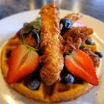 Buttermilk Waffle & Chicken recipe served on a plate, by Hudson's At Main Street Buttermilk Waffle & Chicken recipe served on a plate, by Hudson's At Main Street