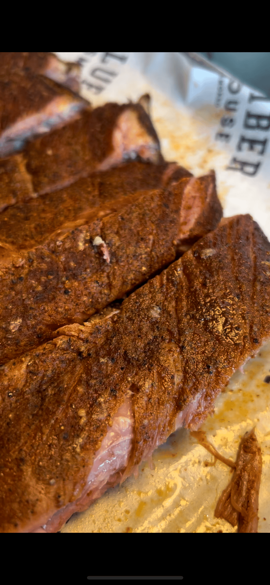 Ribs recipe served on a plate, by Blue Ember Smokehouse Ribs recipe served on a plate, by Blue Ember Smokehouse