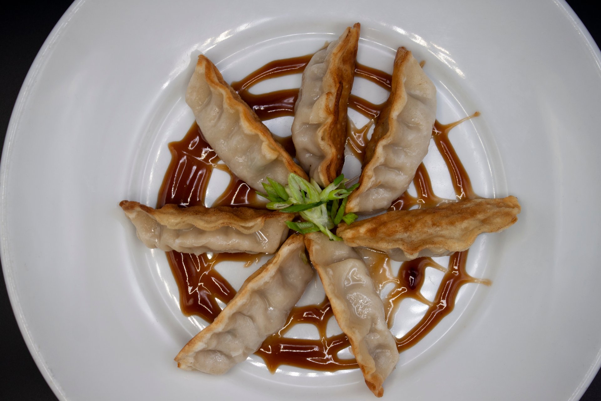 Pot Stickers recipe served on a plate, by Iron Horse Bar & Grill Pot Stickers recipe served on a plate, by Iron Horse Bar & Grill