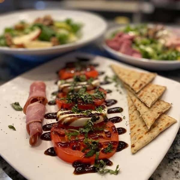 tomato, mozzarella, crackers and rolled meat