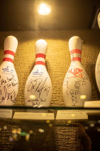Signed bowling pins in a display case