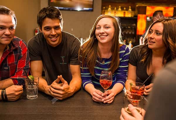 Friends enjoying conversation and drinks
