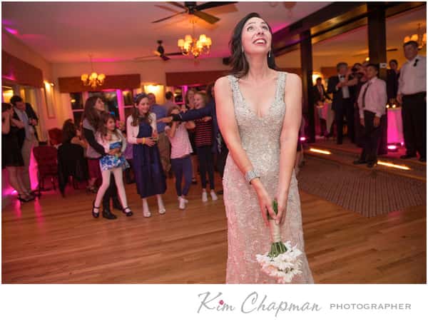 bride tossing bouquet