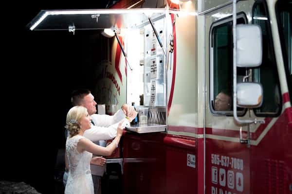 wedding couple ordering from food truck