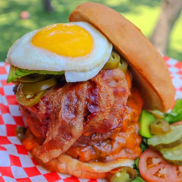 Burger with an egg, jalapenos and bacon