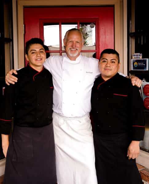 Chefs at Montalcino Ristorante Italiano posing infront of the restaurant holding an award