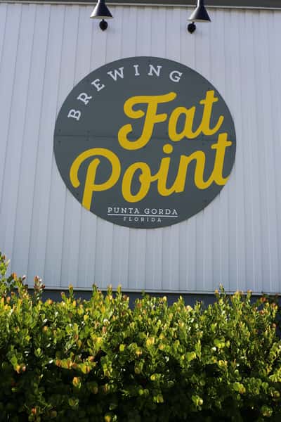 Exterior of Fat Point Brewery showing their logo on the siding