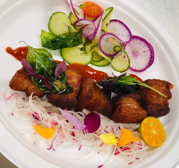 "LECHON KAWALI" (Deep fried pork belly bites) with Radish Cucumber Slaw