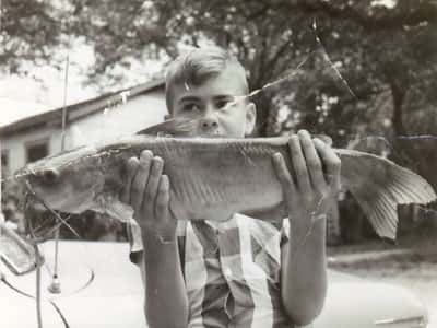 child holding fish
