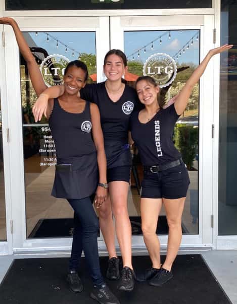 Staff with a variety of meals and drinks