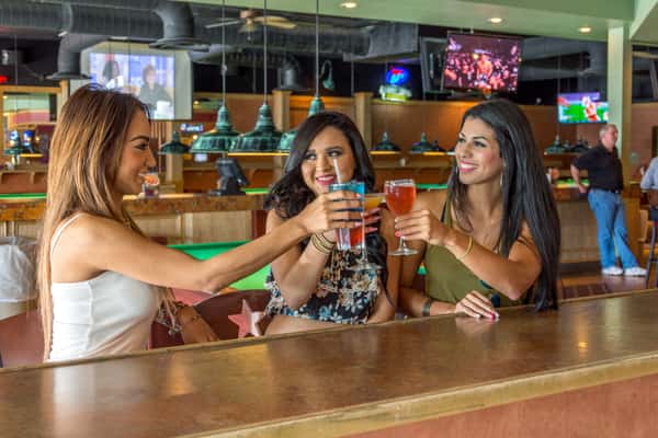 friends toasting bar