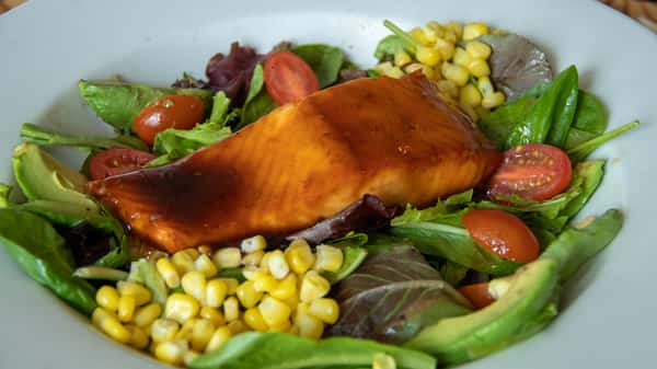Wild-Caught Salmon Filet On Greens